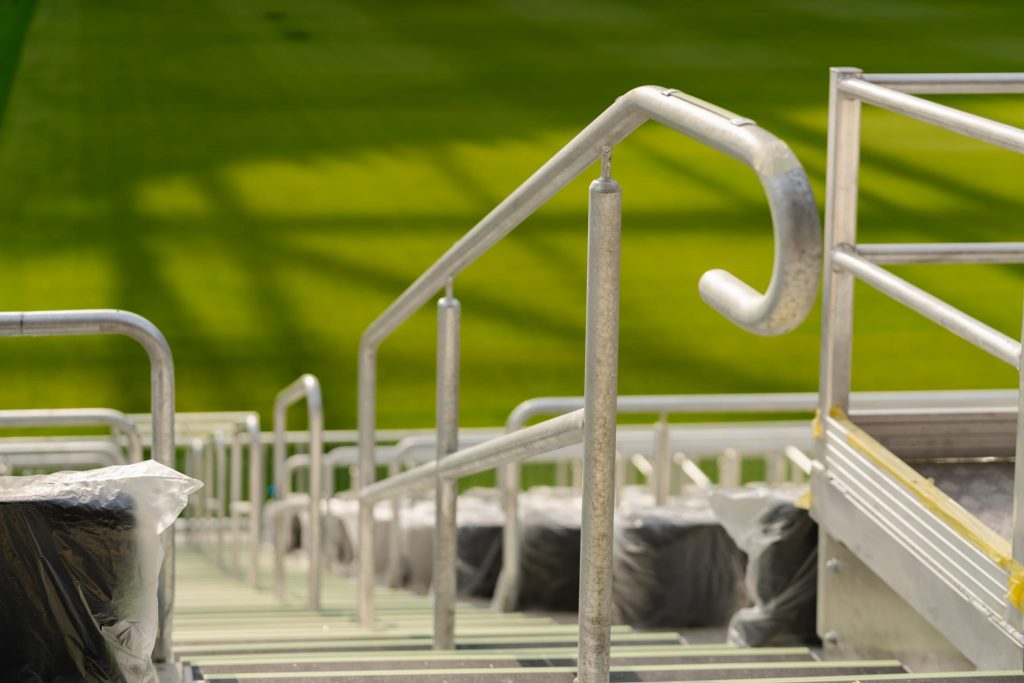 Close-up of Moddex handrail on stadium stairs at One New Zealand Stadium Te Kaha
