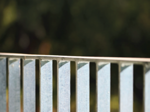 Close-up of a galvanised flat bar balustrade showcasing its slim vertical profile and clean architectural design.